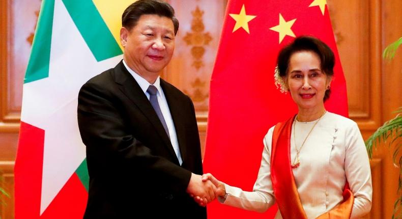 A scatalogical translation error in the name of Chinese President Xi Jinping (L) most notably appeared on the official Facebook page of Myanmar's civilian leader Aung San Suu Kyi (R)