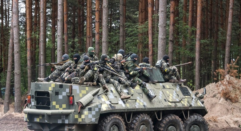 Ukrainian Territorial Defense Forces members on an armored personnel carrier during exercises in a forest near Kyiv on July 13, 2022.Maxym Marusenko/NurPhoto via Getty Images