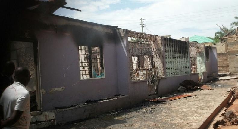 GNFS personnel inspecting the damaged building