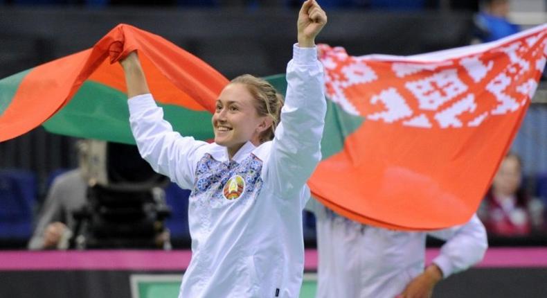 Aliaksandra Sasnovich celebrates putting Belarus into the final of the Fed Cup after her three-set win against Switzerland's Viktorija Golubic on April 23, 2017