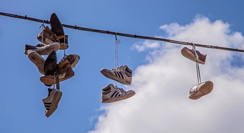 Shoes  hanging on telephone cables