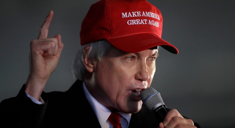 Attorney Lin Wood, a member of President Donald Trump's legal team, gestures while speaking during a rally on Dec. 2, 2020, in Alpharetta, Ga.