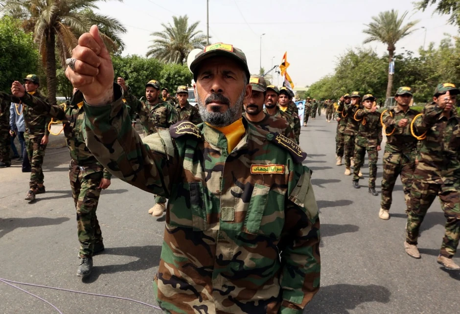 Pripadnici iračke šiitske milicije Al Džihad brigade na paradi u Bagdadu 8. juna 2018.