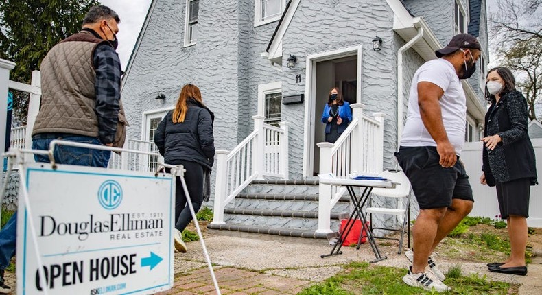 Real estate agents work an open house in West Hempstead, New York.