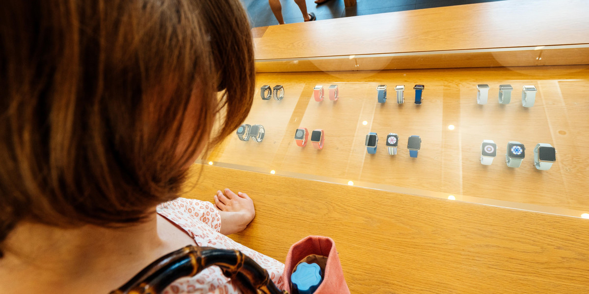 Woman inside Apple Store buy Apple Watch 