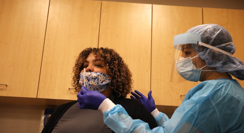 A medical worker conducts a rapid coronavirus test in Brooklyn, New York, on August 27, 2020.