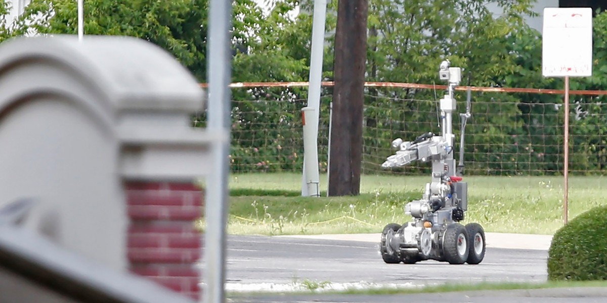 Dallas Police use a robot to gain access to an armored van in June 2015.