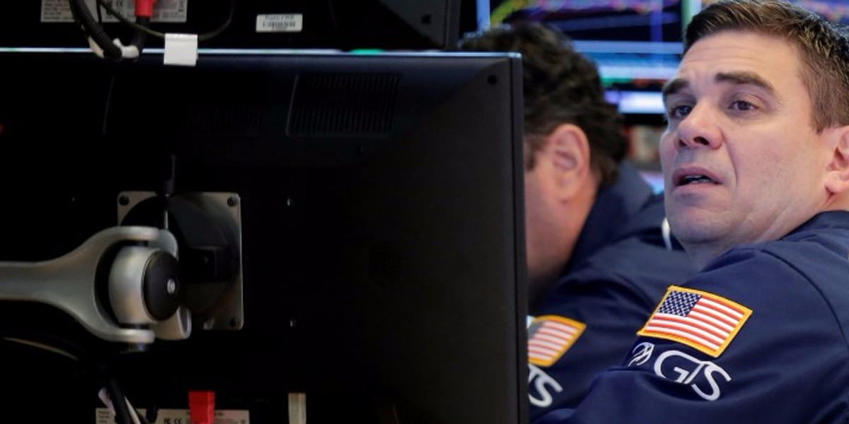 Traders work on the floor of the NYSE