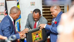 Treasury CS Njuguna Ndung'u with PS Chris Kiptoo having a look at Kenya's budget briefcase