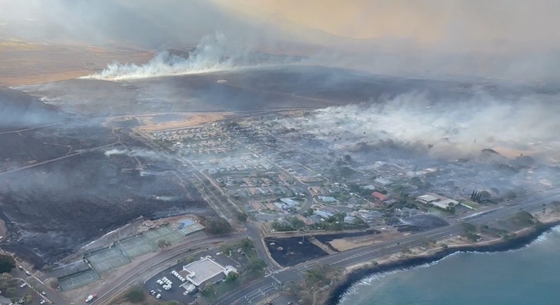 An aerial view as smoke rises from burnt areas amidst wildfires in Maui, Hawaii, U.S., August 9, 2023, in this screenshot taken from a social media video.Vince Carter via REUTERS