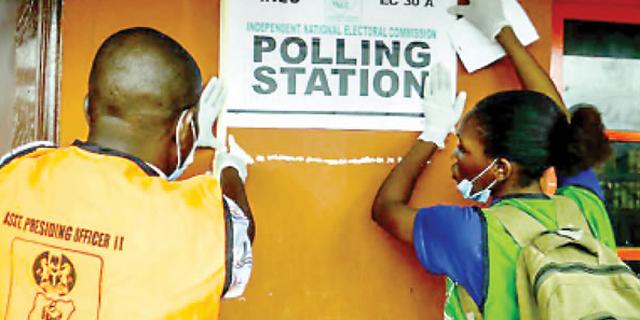 INEC officials at a polling unit. (Tribune)