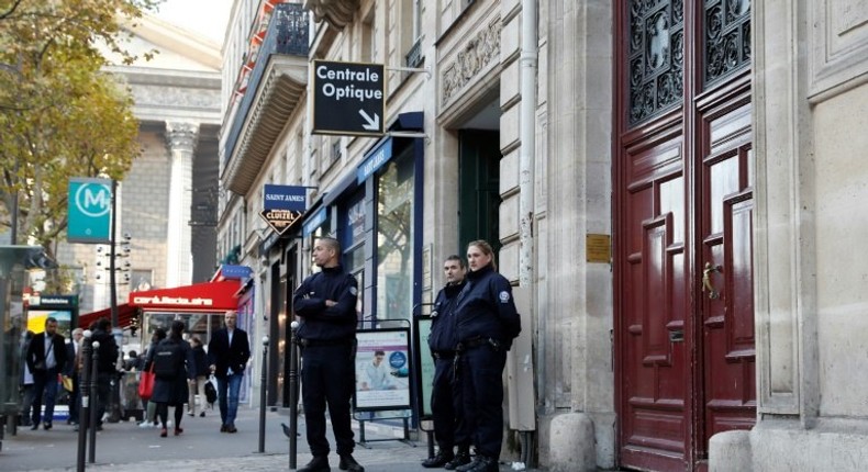 Police stand guard at the entrance of the luxury residence where US reality television star Kim Kardashian was robbed at gunpoint by assailants disguised as police, in Paris, in October 2016