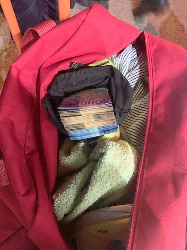 A bag with sneakers in which money was found hidden 