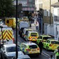 Police vehicles line the street near Parsons Green tube station in London