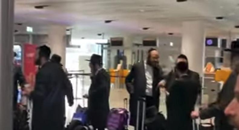 Orthodox Jewish passengers wait in line after being barred from boarding a connecting Lufthansa flight to Budapest.Dan's Deals