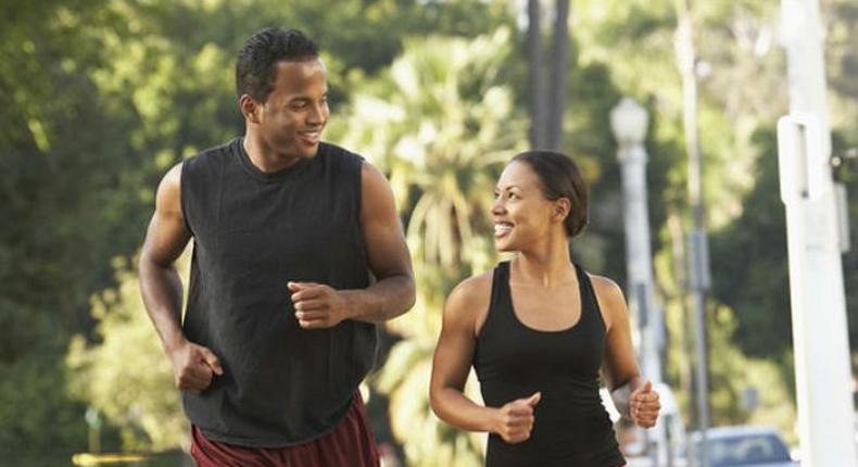 Black man and woman running
