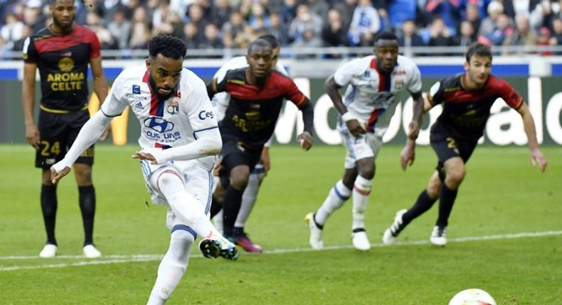 Lyon's French forward Alexandre Lacazette shoots a penalty and scores during the French L1 football match between Olympique Lyonnais and EA Guingamp on October 22, 2016