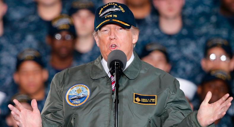 President Donald Trump gestures as he speaks to Navy and shipyard personnel aboard nuclear aircraft carrier Gerald R. Ford at Newport News Shipbuilding in Newport News, Va., Thursday, March 2, 2017. The ship which is still under construction is due to be delivered to the Navy later this year.