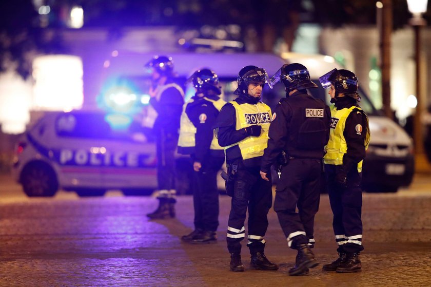 Police secure the Champs Elysees Avenue after one policeman was killed and another wounded in a shoo