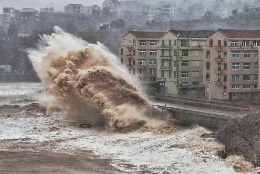 Cars are partially submerged in floodwaters after Typhoon Lekima hit Dajing town in Wenzhou, Zhejian