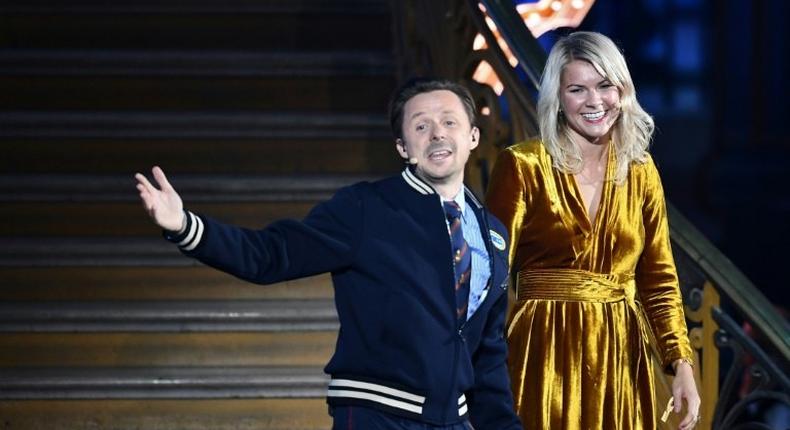 Norwegian forward Ada Hegerberg (R) stands alongside French DJ and producer Martin Solveig (L) after receiving the 2018 women's Ballon d'Or award.