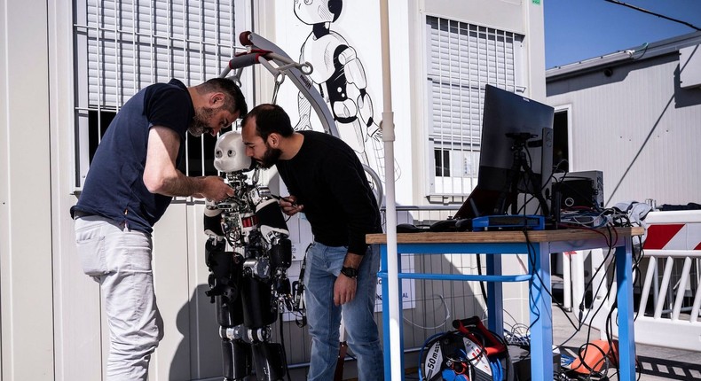 Engineers work on the iCub 3 robot at the Italian Institute of Technology (IIT) in Genoa on April 27, 2022.MARCO BERTORELLO/AFP via Getty Images