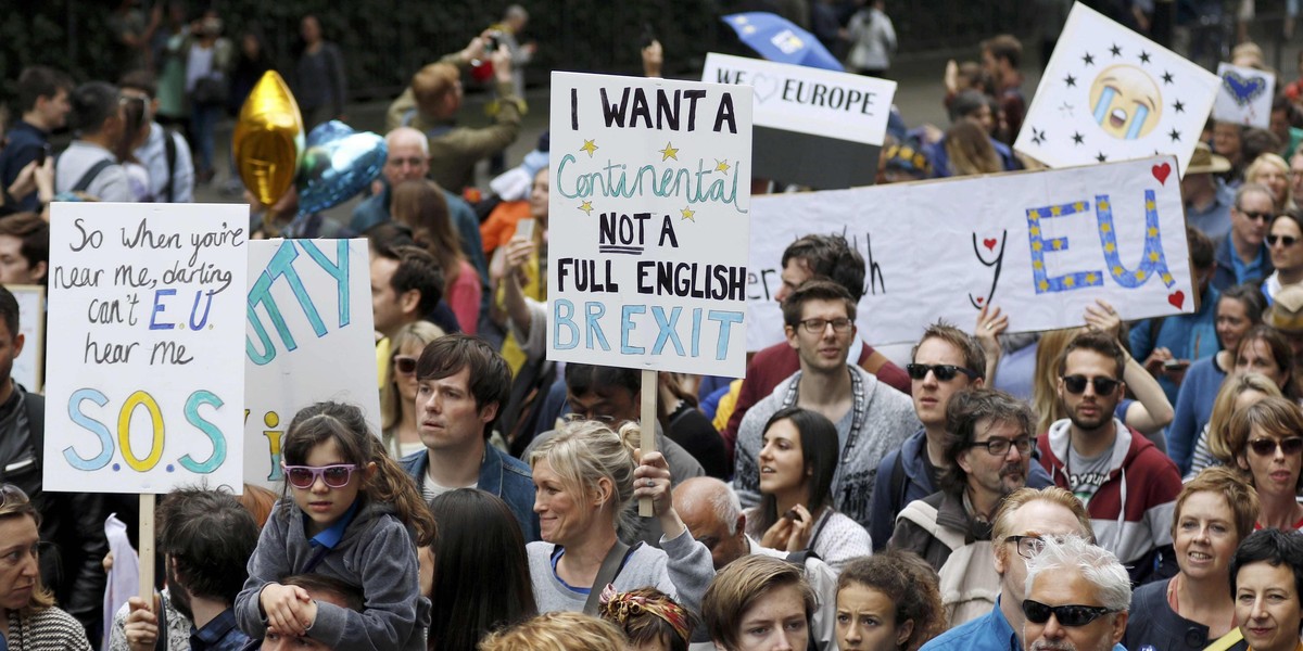 People hold banners during a demonstration against Britain's decision to leave the European Union, in central London