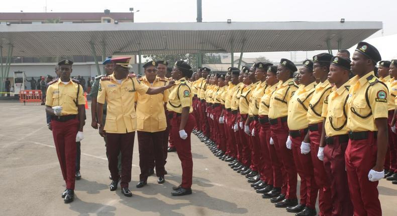 Gov. Babajide Sanwo-Olu of Lagos State adjusting the collar of one of the newly recruited officials of Lagos State Traffic Management Authority (LASTMA) during their passing out parade in Lagos on Wednesday (Twitter/@followlasg)