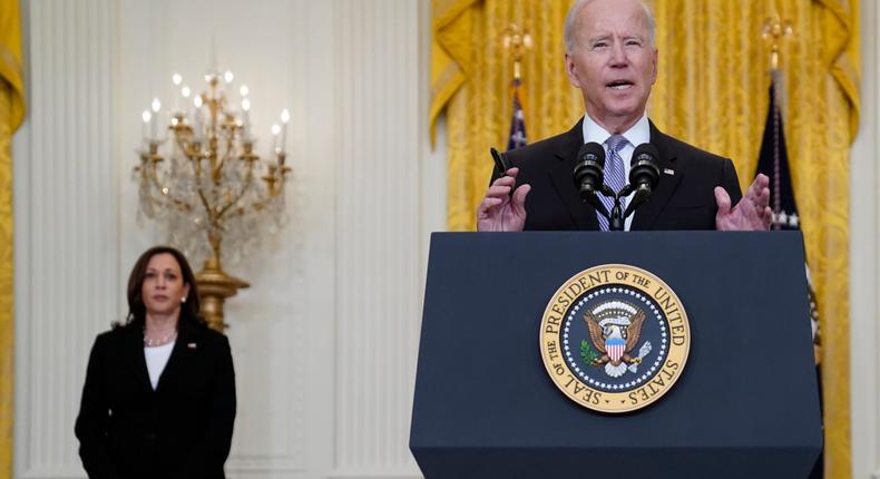 Vice President Kamala Harris listens as President Joe Biden speaks about distribution of COVID-19 vaccines at the White House on May 17, 2021.
