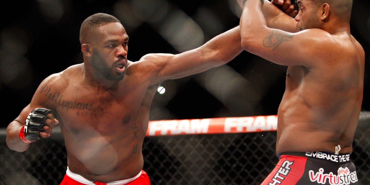 Light heavyweight champion Jon Jones punches at Daniel Comier during the UFC 182 event at the MGM Grand Garden Arena on January 3, 2015 in Las Vegas, Nevada.