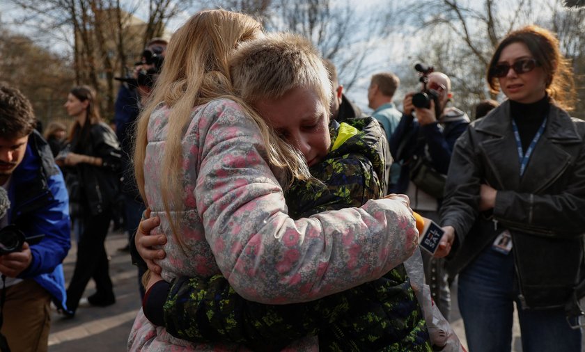 10-year-old Kira walks after crossing the Belarus-Ukraine border, in Volyn region