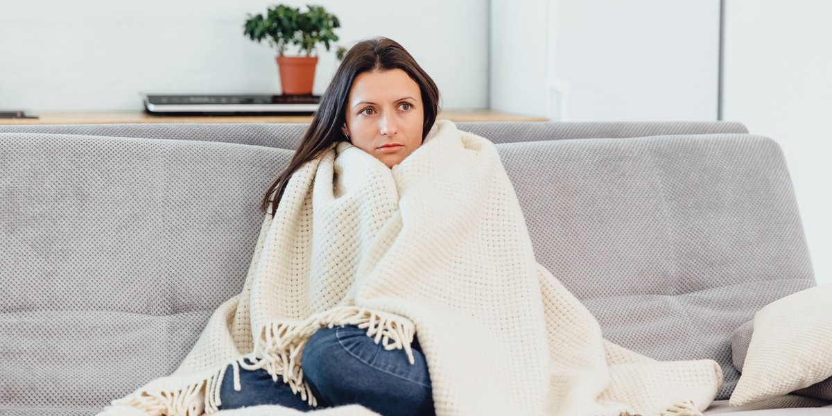 Woman looks TV on the couch