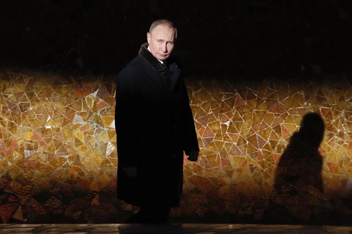 Russian President Putin attends a wreath laying ceremony at the eternal flame during an event to commemorate the 75th anniversary of the battle of Stalingrad in World War Two, at the Mamayev Kurgan memorial complex in Volgograd