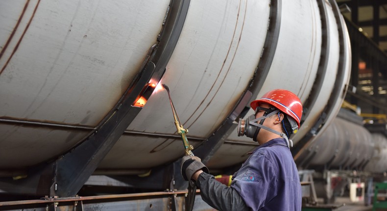 A worker is working at a tank truck production workshop in Fuyang city, East China's Anhui province, April 28, 2024.CFOTO/Future Publishing via Getty Images