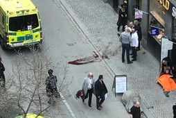 Ambulance in a street near the site were a truck was driving into a crowd in central Stockholm