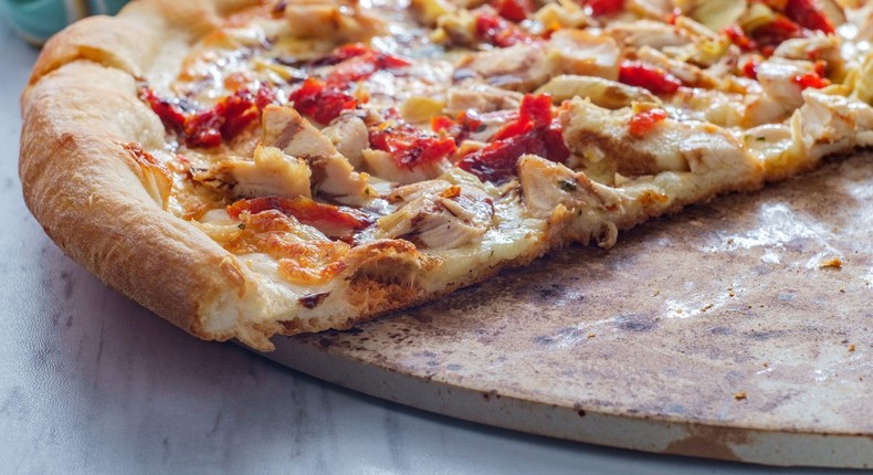 Pizza stones are porous so they can absorb the taste of soap.EzumeImages/Getty Images