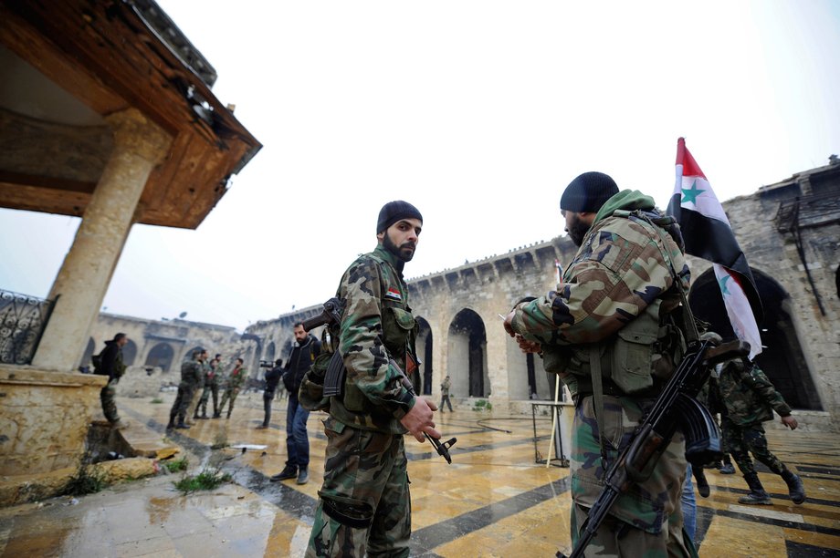 Forces loyal to Syria's President Bashar al-Assad stand inside the Umayyad mosque, in the government-controlled area of Aleppo, during a media tour, Syria December 13, 2016.