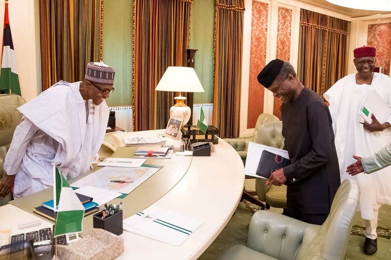 President Muhammadu Buhari and Vice President, Yemi Osinbajo share a joke in Buhari's office (Presidency)  