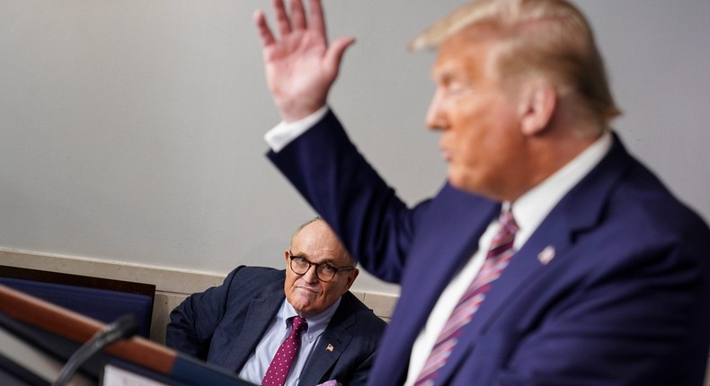 Rudy Giuliani and then-President Donald Trump at the White House briefing room.
