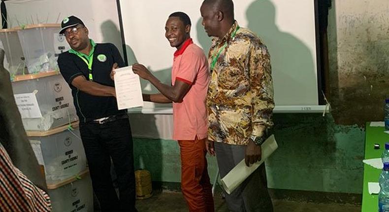 Ruben Katana of ODM party receives the IEBC election certificate for Ganda Ward