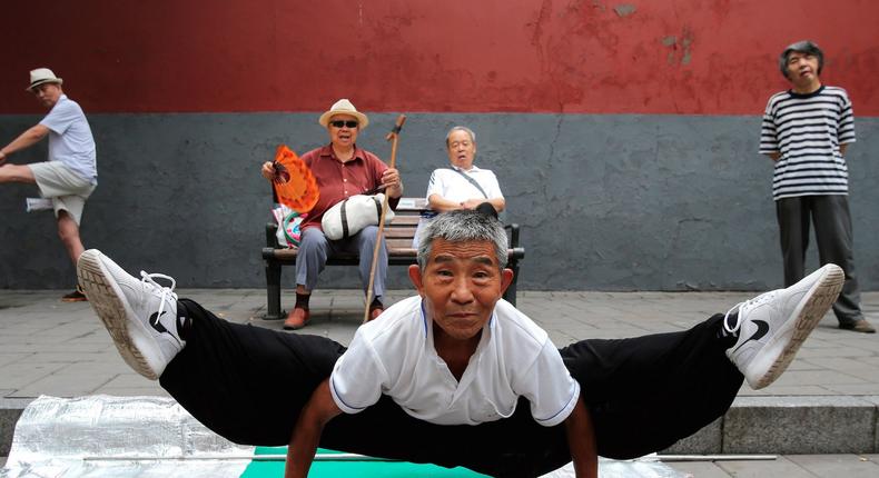 A man practicing Kung Fu at Beihai Park in Beijing.