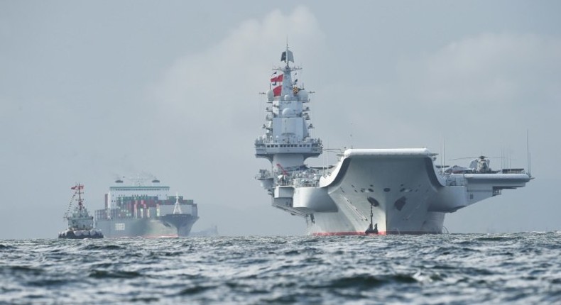 Beijing sent its only aircraft carrier, the Liaoning (r), through the Taiwan Strait in January during a drill and also in July when it was en route to Hong Kong