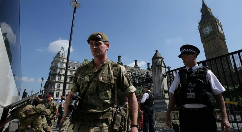 Troops and armed police are patrolling the streets, a rare sight in Britain