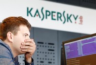 FILE PHOTO: An employee works near screens in the virus lab at the headquarters of Russian cyber security company Kaspersky Labs in Moscow