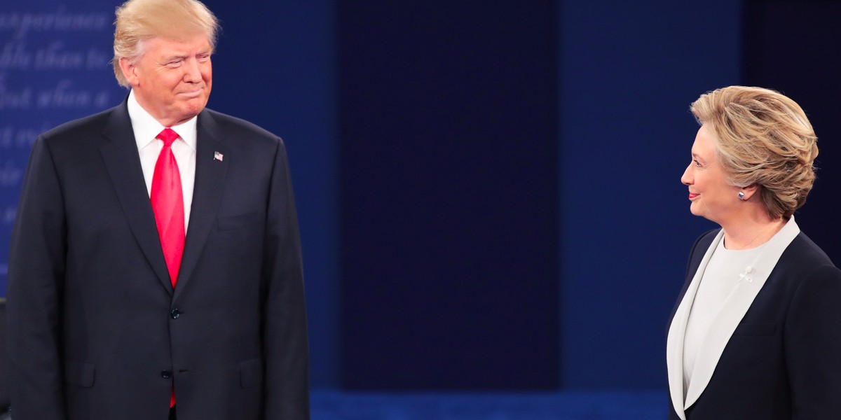 Republican presidential nominee Donald Trump (L) and Democratic presidential nominee former Secretary of State Hillary Clinton during the town hall debate at Washington University on October 9, 2016 in St Louis, Missouri.