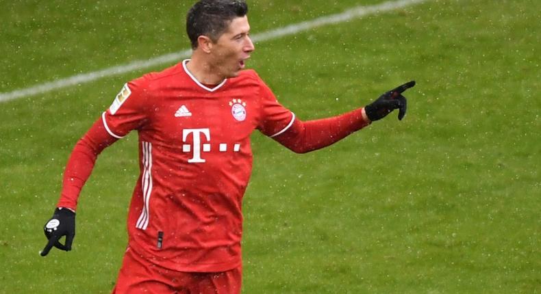 Bayern Munich striker Robert Lewandowski celebrates scoring a league-record 21 goals for the first half of the season