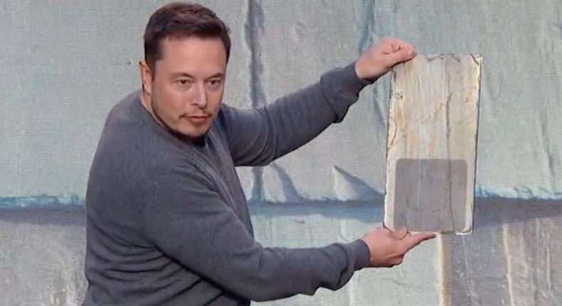 Elon Musk with the French slate solar shingle option.