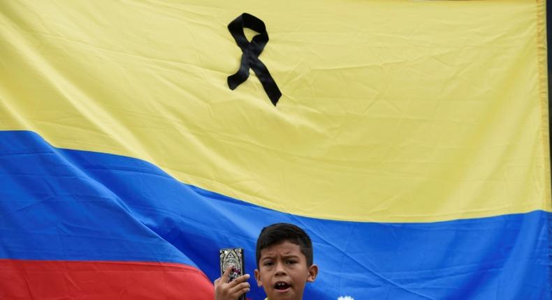 Thousands of people marched throughout Colombia on Sunday to condemn the car bombing, the deadliest attack with explosives in the city of Bogata since 2003