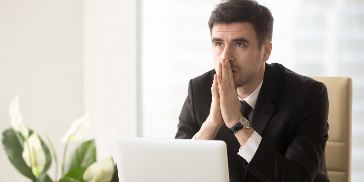 Pensive entrepreneur pondering serious problem