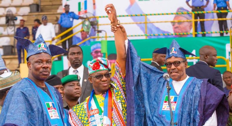 President Muhammadu Buhari (right) endorses Dapo Abiodun (centre) as the APC's Ogun governorship candidate, despite the public objection of Governor Ibikunle Amosun (left) [Ayodeji Ogunro]